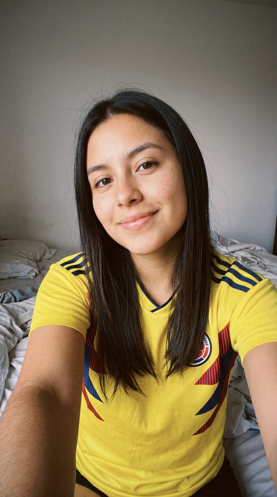 Laura smiling in a Colombia national team jersey